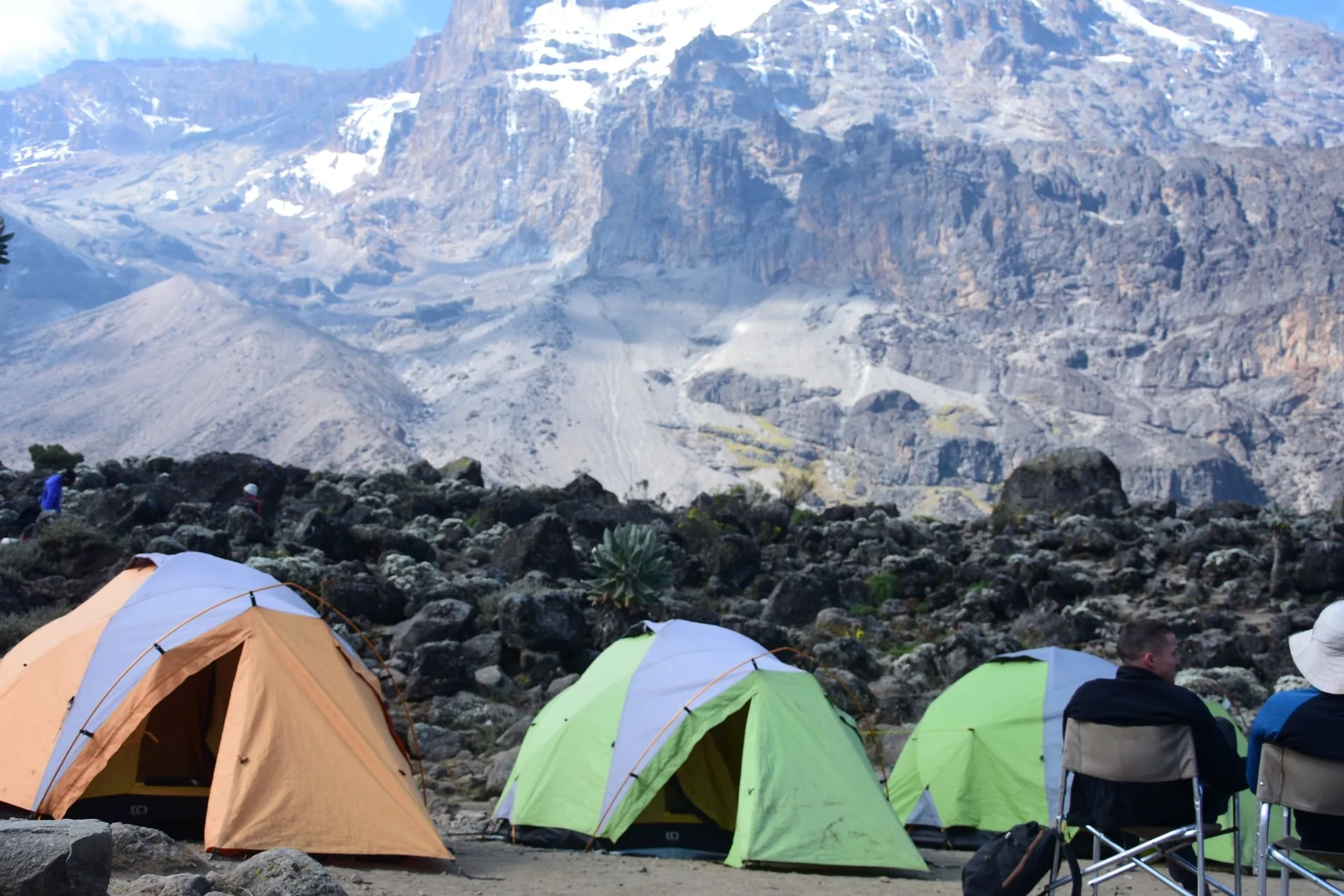 Climbers celebrating at Uhuru Peak summit on Mount Kilimanjaro